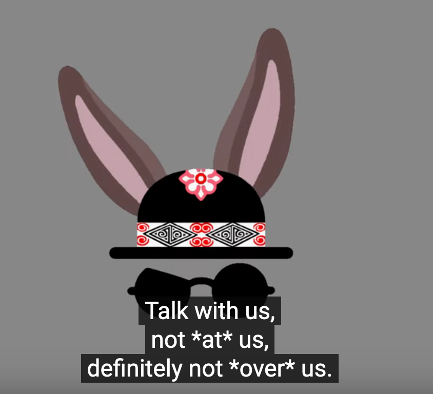 "Talk with us, not *at* us, definitely not *over* us." with a sunglass bunny behind it.